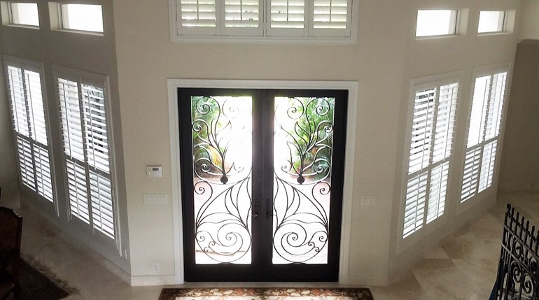Jacksonville foyer with glass doors and plantation shutters